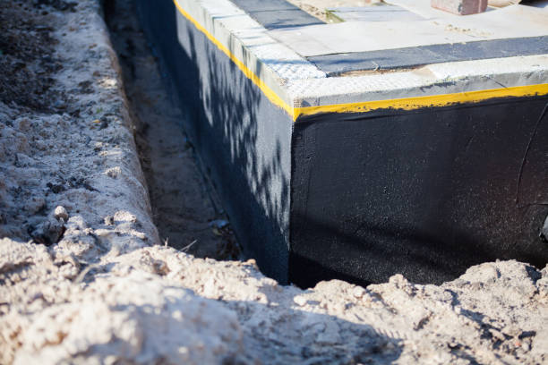 Professional Waterproofing technician working in Viola, IL